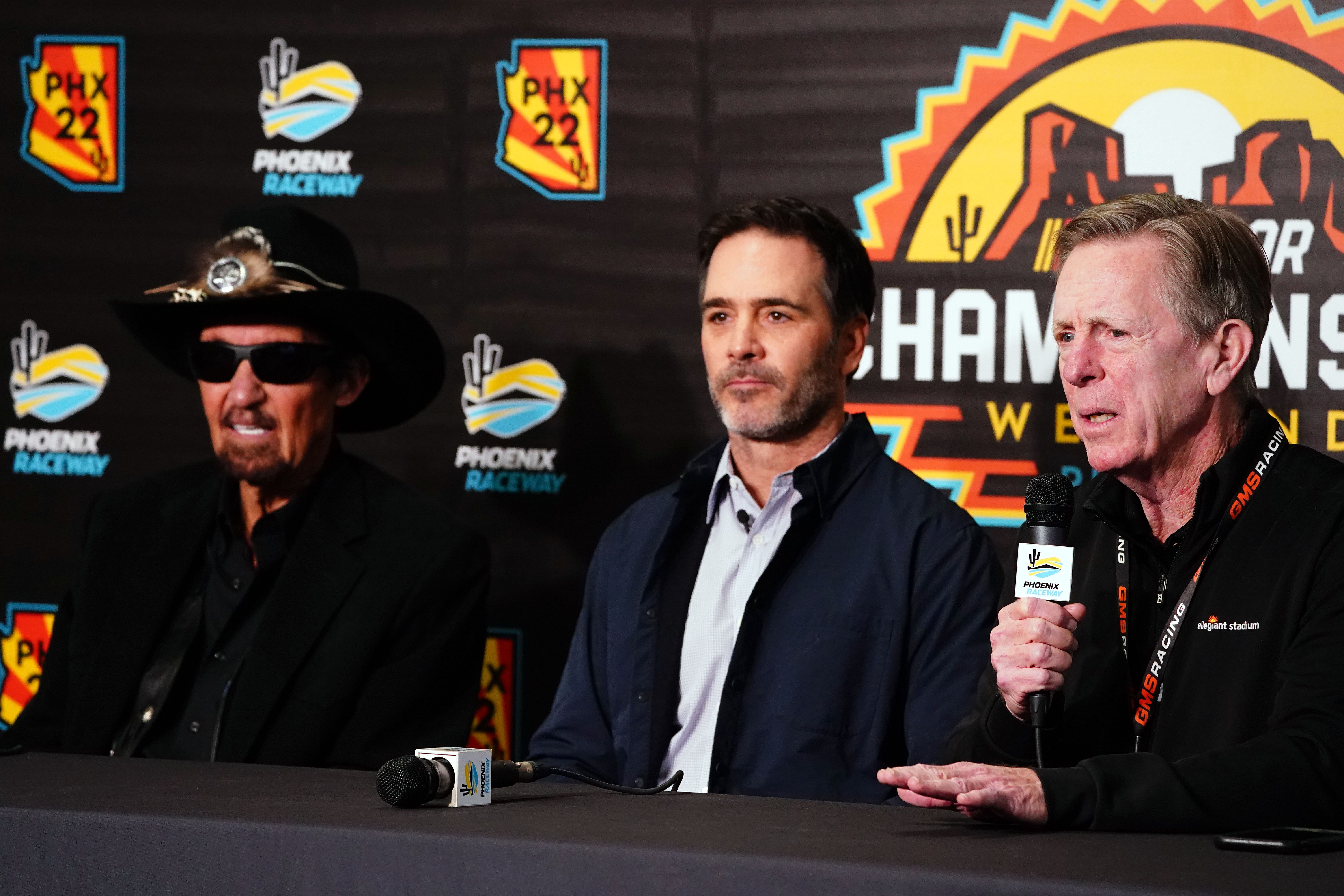 Maury Gallagher (R) talks with the media alongside Jimmie Johnson (C) and Richard Petty. Source: Imagn